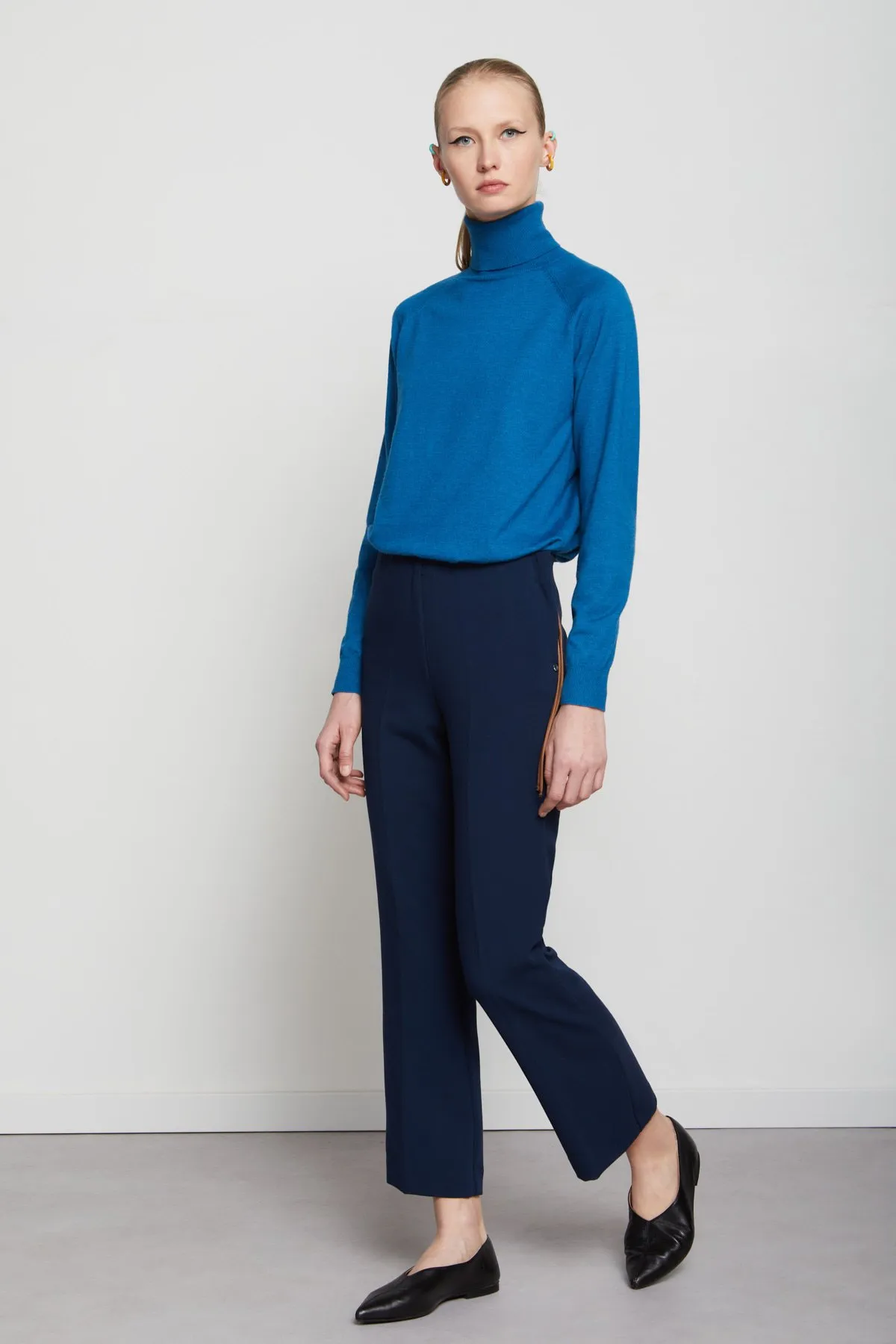 Trousers with pleats